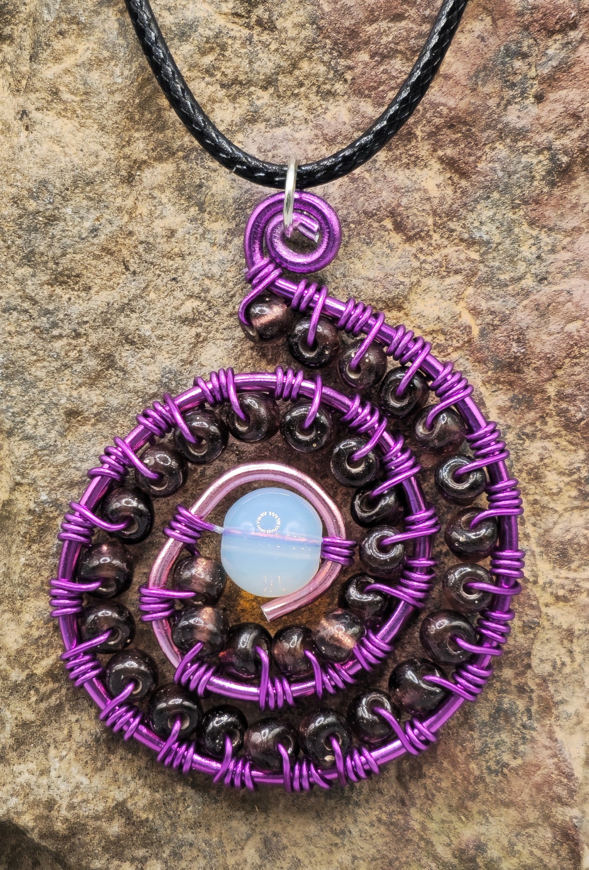 Opalite and purple beaded spiral pendant