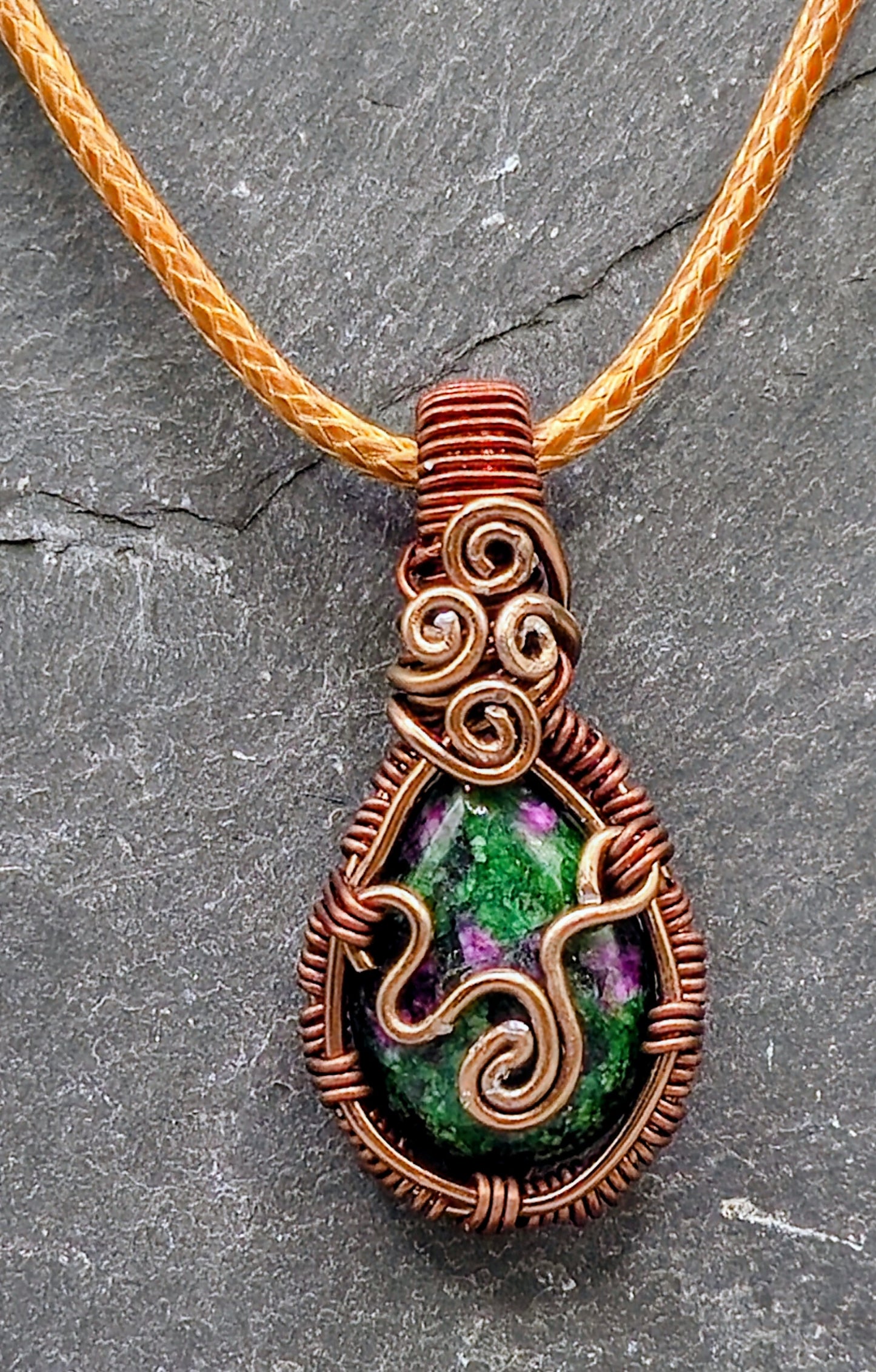 Intricate brown wire-wrapped stone pendant