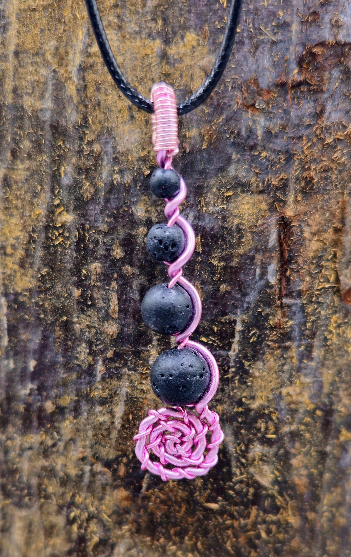 Pink wire Lava stone spiral pendant