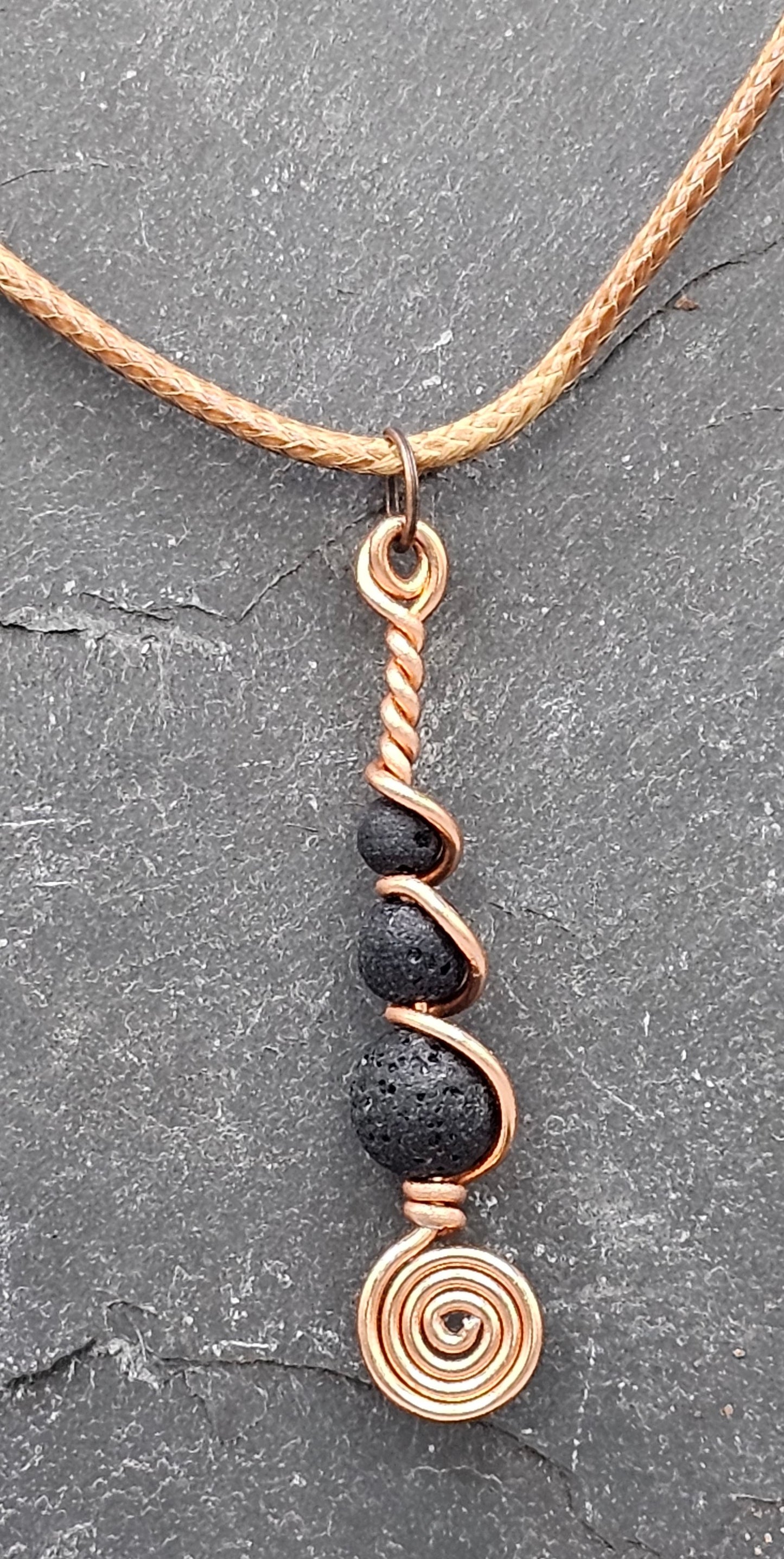 Copper and 3 lava stone pendant