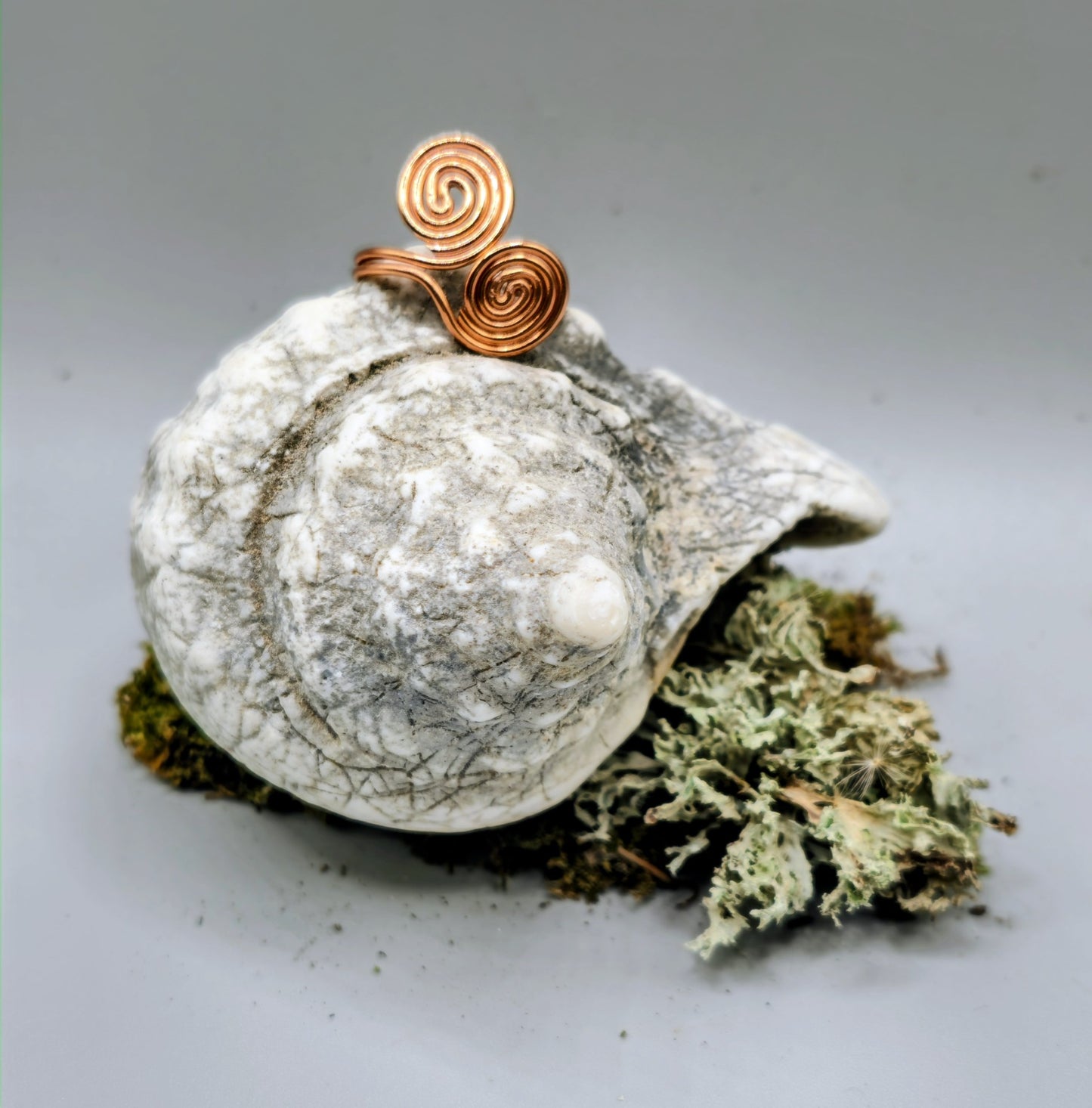 Copper coloured twin spiral ring