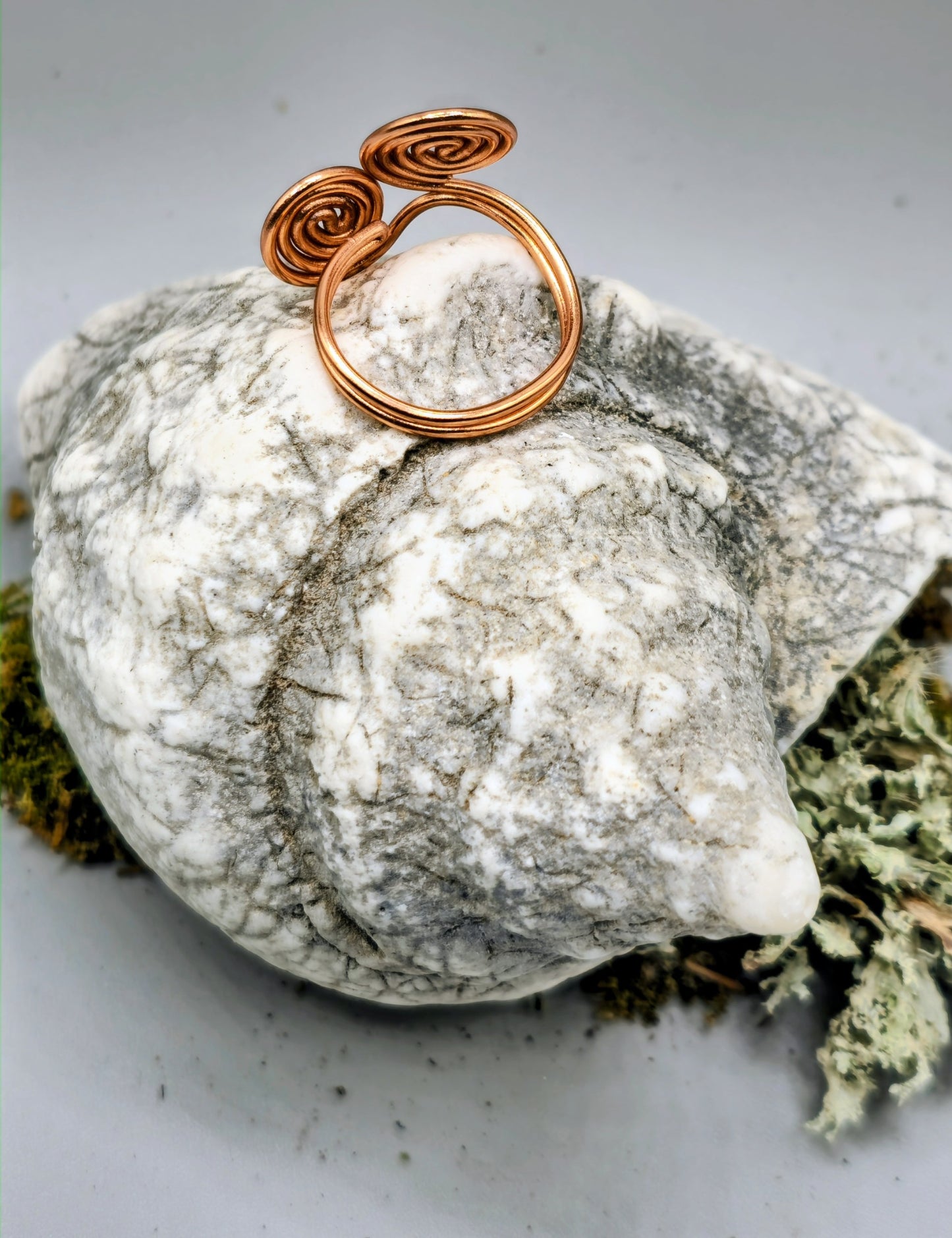 Copper coloured twin spiral ring
