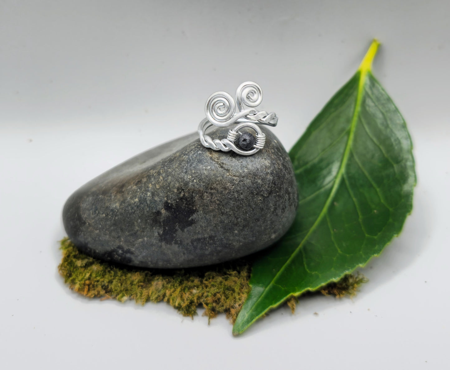 Silver spiral and Lava stone ring