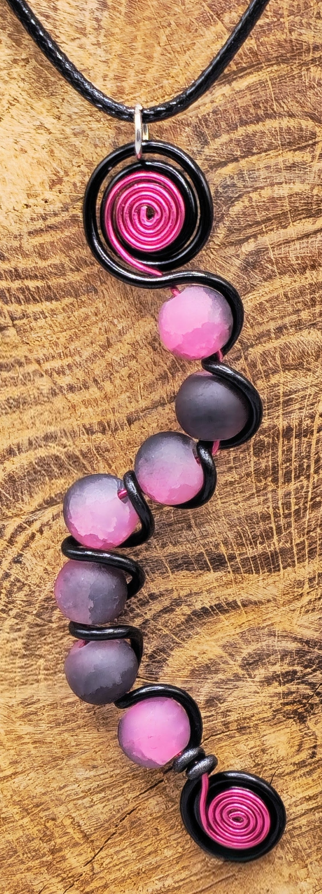 7 bead pink and black pendant