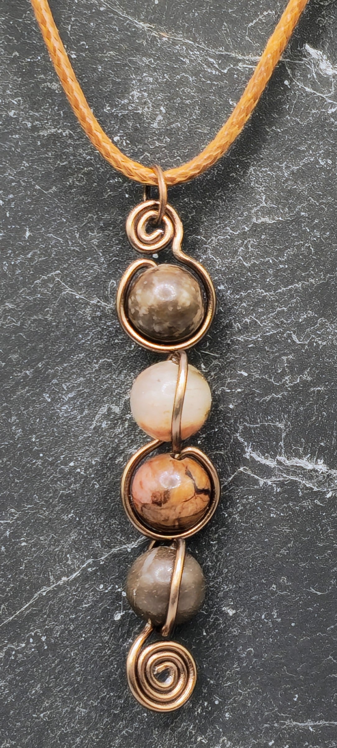 4 Rhodonite bead back and forth pendant
