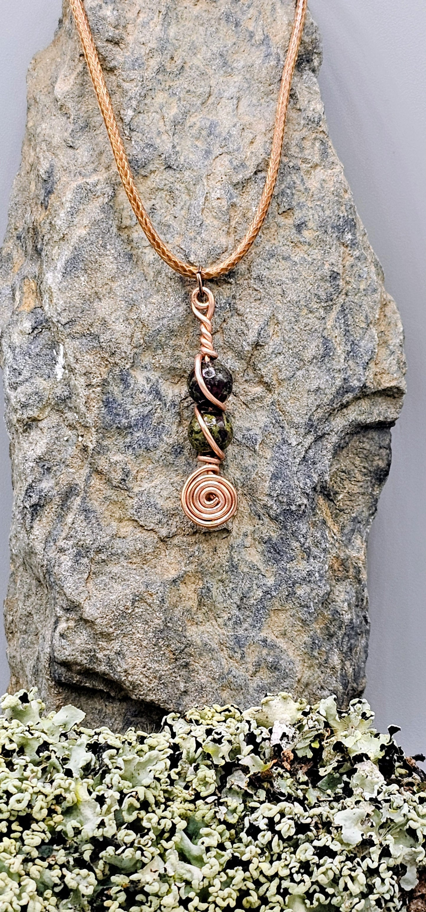 Dragon Blood stone spiral pendant