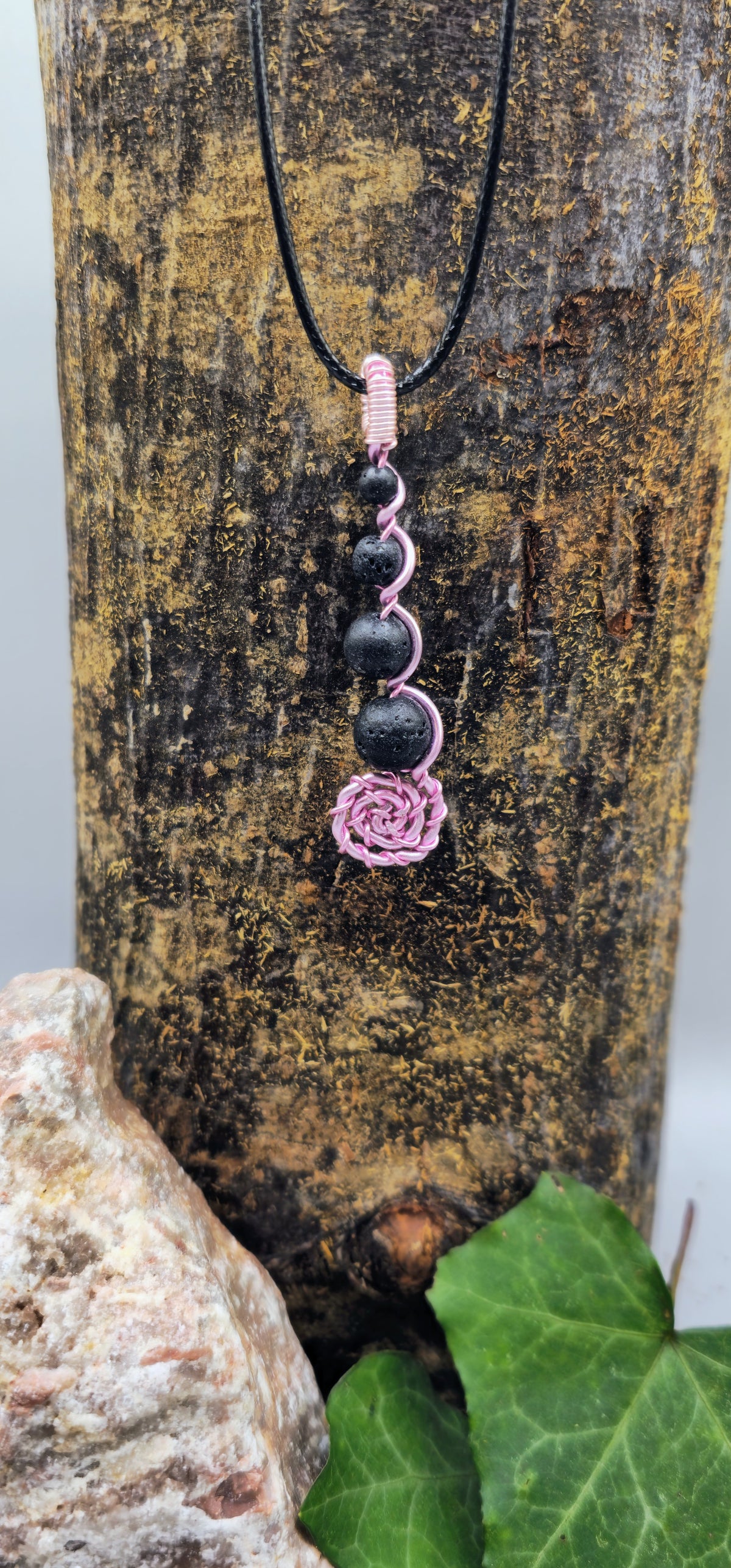 Pink wire Lava stone spiral pendant