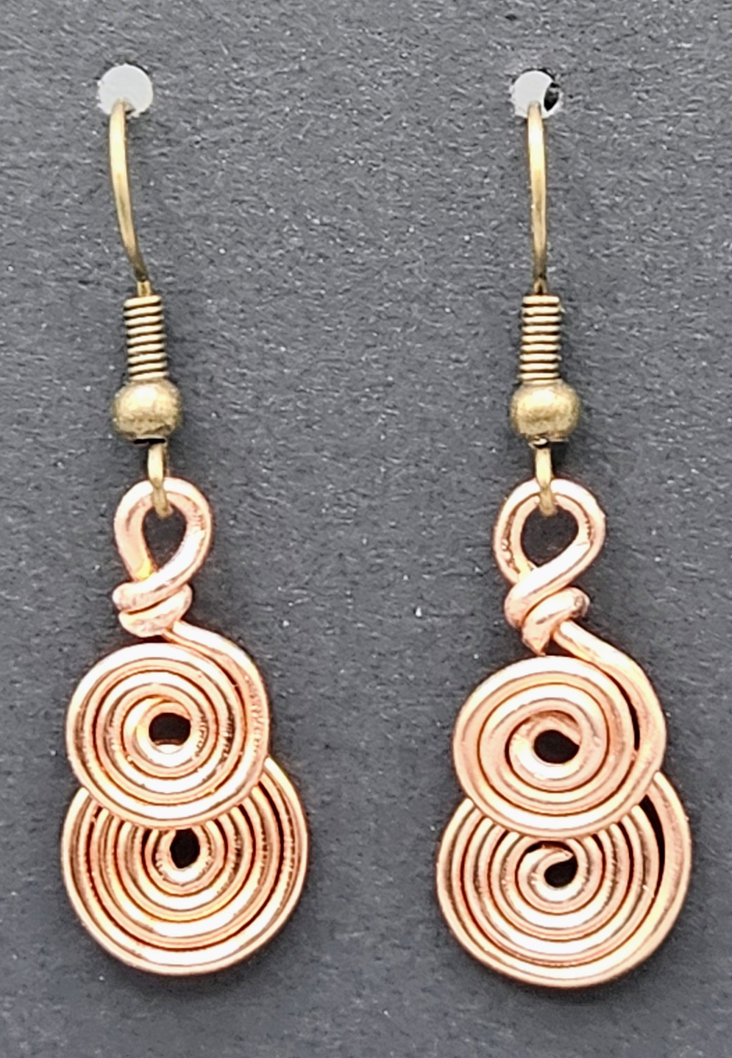 Copper coloured spiral earrings