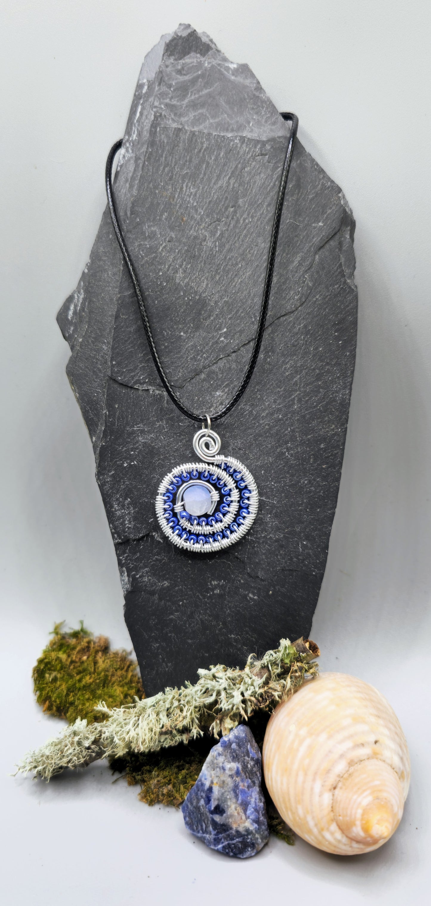 Blue and silver beaded spiral pendant