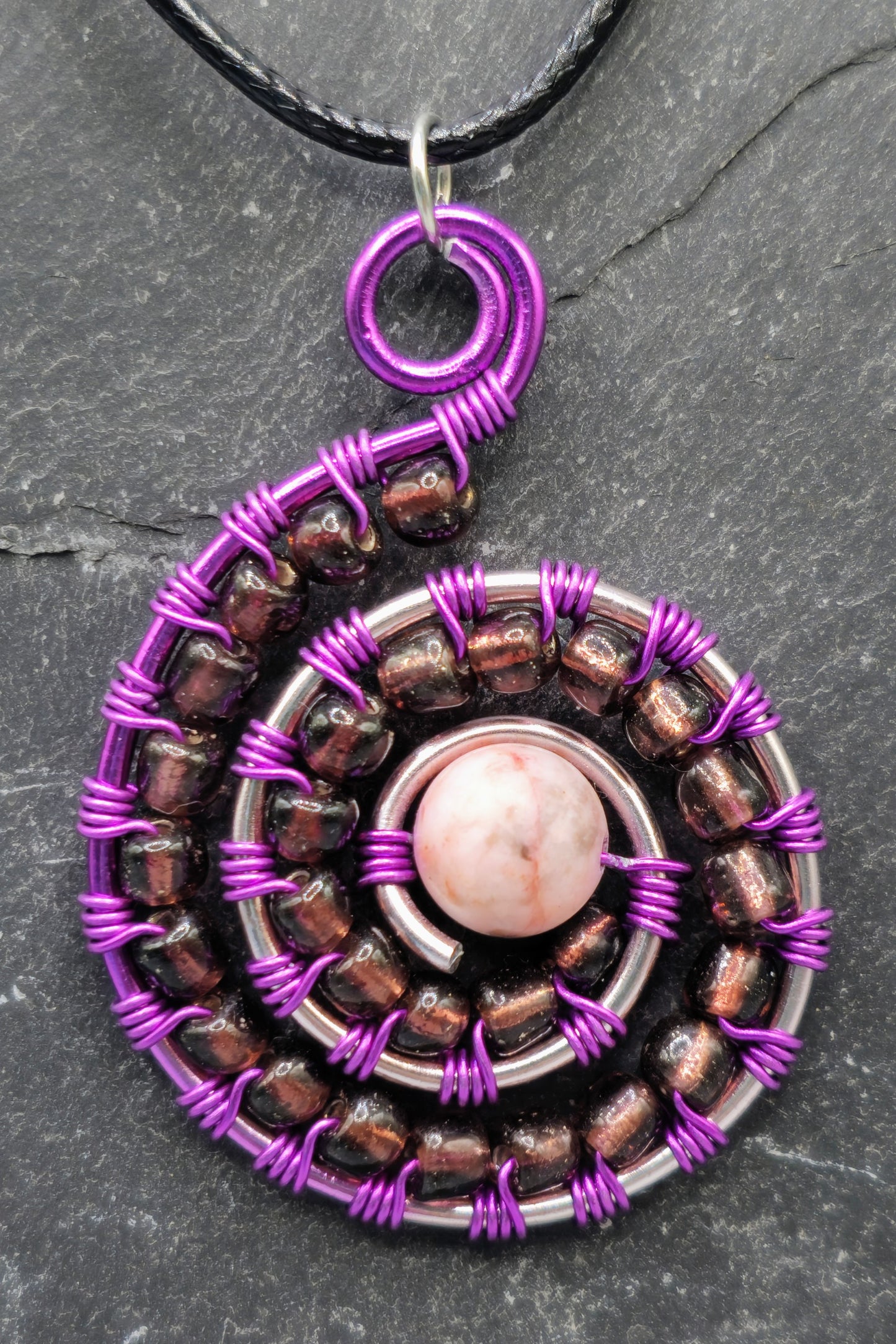 Rhodonite and purple bead spiral pendant