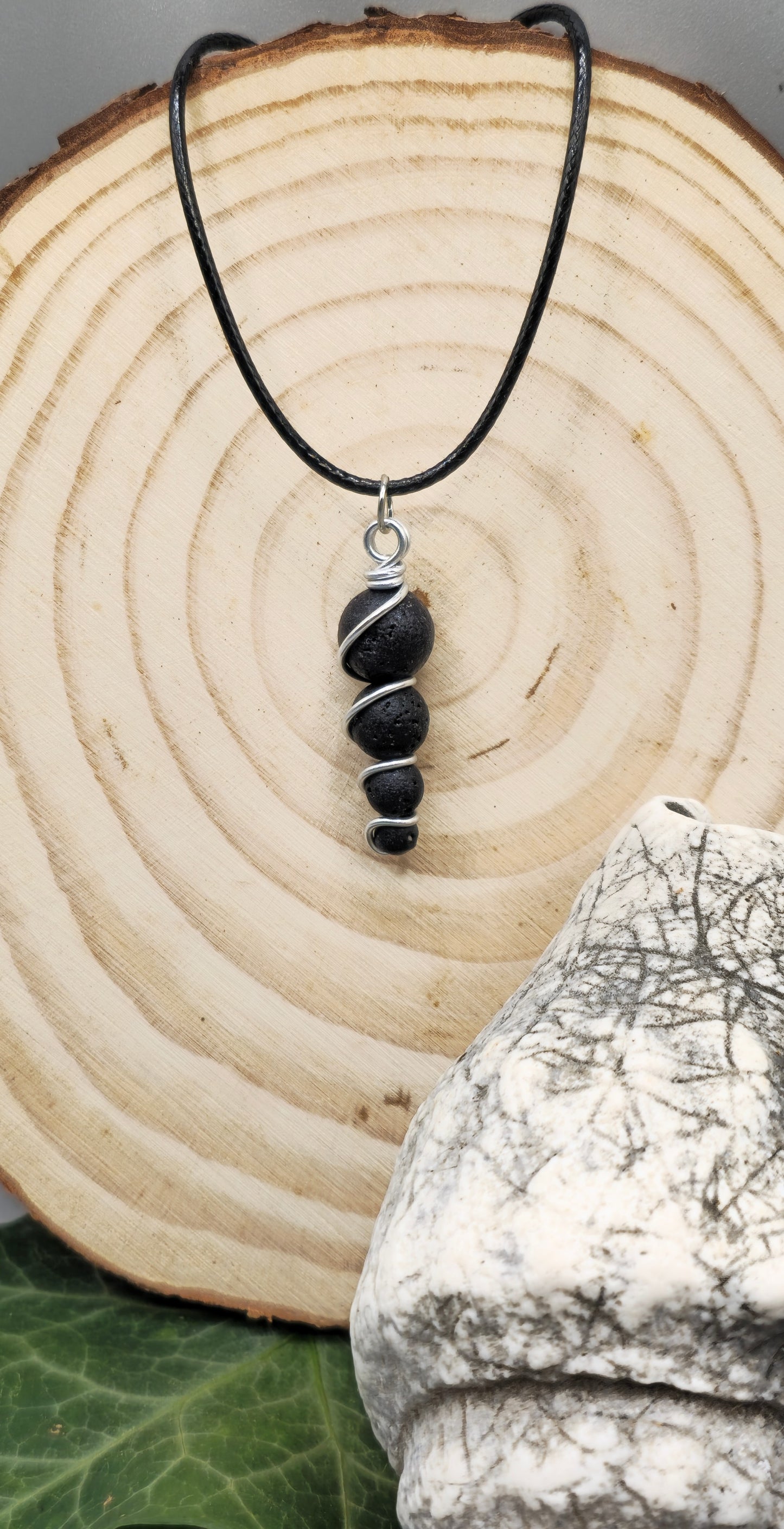 4 descending Lava stone bead pendant