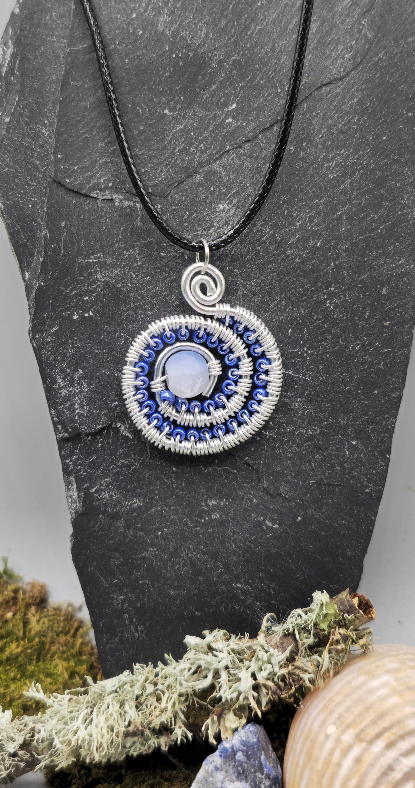 Blue and silver beaded spiral pendant