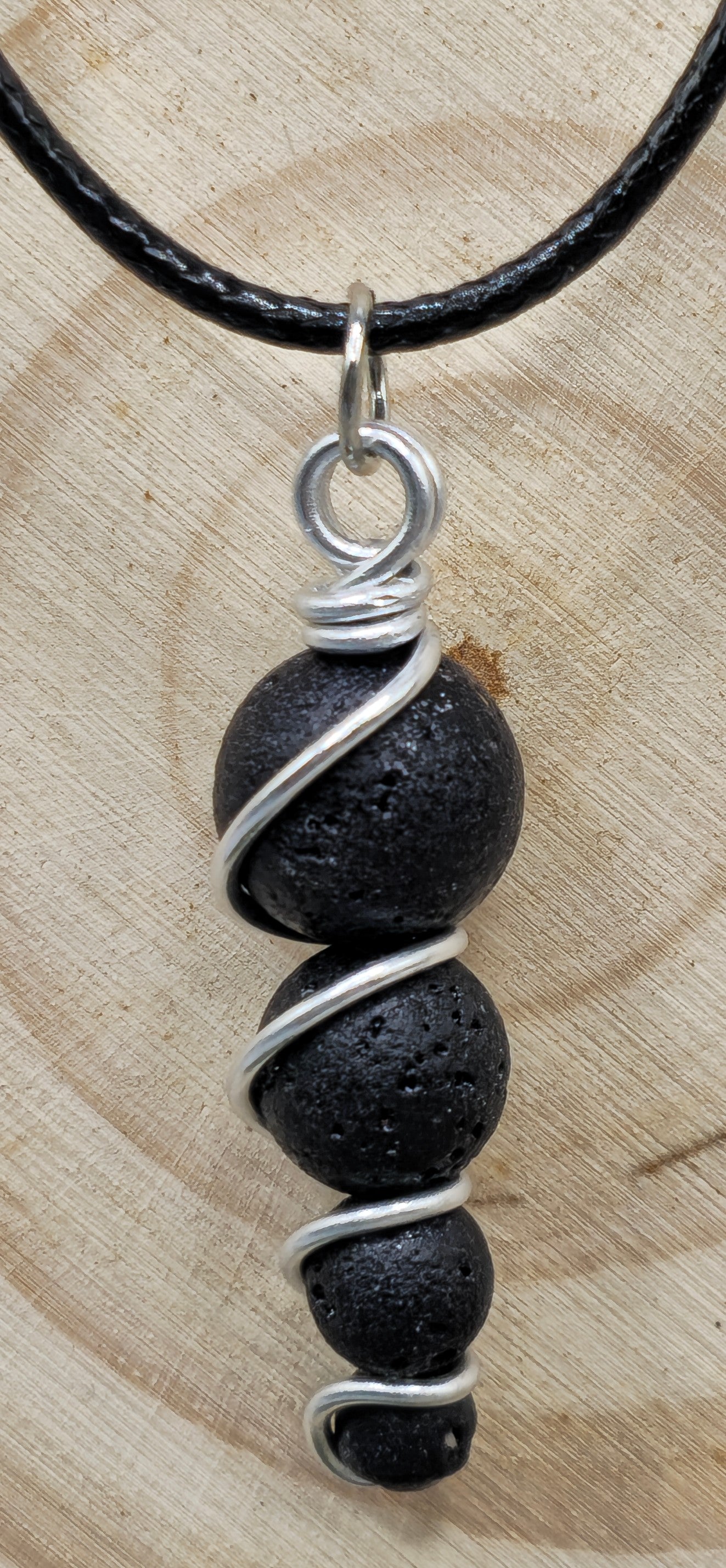 4 descending Lava stone bead pendant